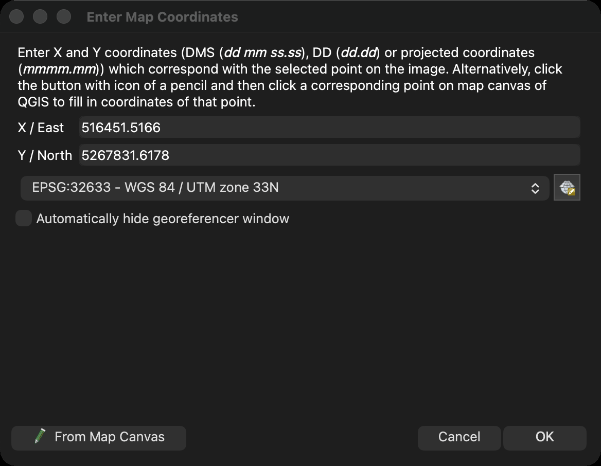 Screenshot of the QGIS Enter Map Coordinates dialog in the dark theme, shown on its own. A paragraph at the top explains that coordinates may be given in degrees minutes seconds, in decimal degrees or as projected coordinates, or picked from the QGIS map canvas. The X / East field holds 516451.5166 and the Y / North field holds 5267831.6178, which is the map coordinate of mark A15 from control-points-truth.csv. Below them a CRS selector reads EPSG:32633 WGS 84 / UTM zone 33N, and an unticked box offers to hide the georeferencer window automatically. From Map Canvas, Cancel and OK buttons sit along the bottom.